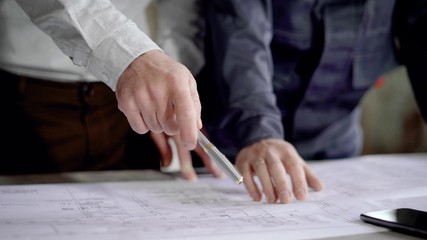 Cabinet of the chief architect of the construction of an industrial facility. There is a discussion...