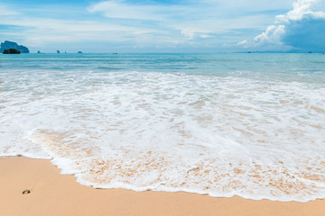 beautiful wave with white foam on the sandy shore of Thailand, Krabi resort
