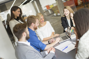 Multiracial businesspeople having meeting in conference room.