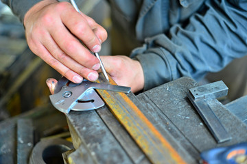 metal sawing close up, angled marking