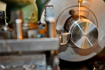 Professional machinist. Horizontal shot of a man operating lathe grinding machine metalworking industry concept copyspace