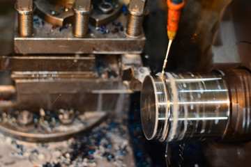 Professional machinist. Horizontal shot of a man operating lathe grinding machine metalworking industry concept copyspace