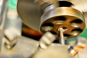 Professional machinist. Horizontal shot of a man operating lathe grinding machine metalworking industry concept copyspace