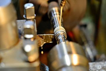 Professional machinist. Horizontal shot of a man operating lathe grinding machine metalworking industry concept copyspace