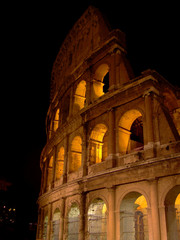 Fototapeta premium Portion of the Roman Forum also known as the Coliseum in beautiful Rome at night .