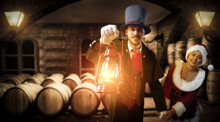Fototapeta premium xmas time and man with lamp and wine barrels 
