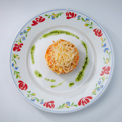 simple dish of Russian, Belarusian, Ukrainian cuisine on a white background, salad with carrots and cheese