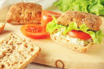veggie burger with tomatoes, cheese and lettuce