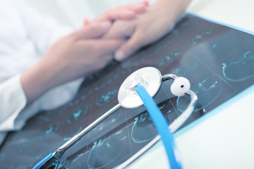 Doctor speaking with patient in his office