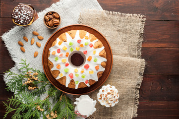 traditional decorated christmas cake at wooden table