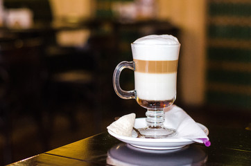 Cup of coffee latte in coffee shop