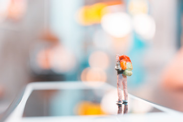 Miniature backpacker , Tourist people standing on smartphone , Travel concept
