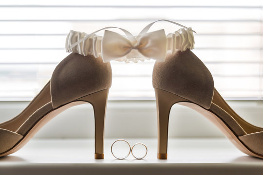 Bridal wedding decorations. Wedding rings shoes and garter