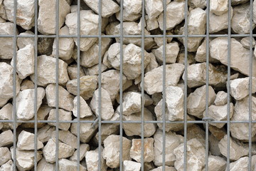 stones behind a net