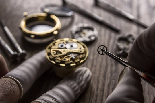 Watchmaker is repairing the mechanical watches in his workshop