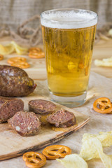 Beer, sausages, pretzels and chips. Octoberfest theme