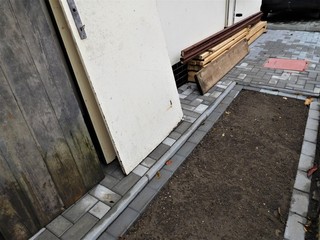 The building new sidewalk and some boards for it