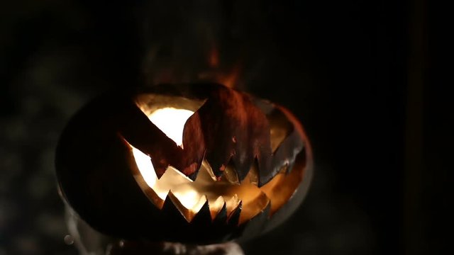 Burning pumpkin on Halloween. Looped