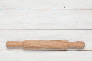 A wooden rolling pin. Accessories for baking. Preparation for cooking. View from above.