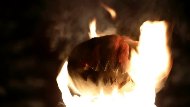 Burning pumpkin on Halloween. Looped