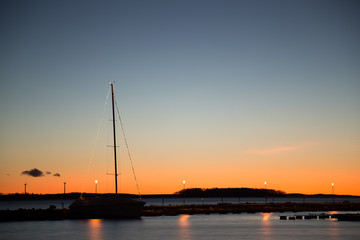 Fototapeta na wymiar Sailboat at sunset