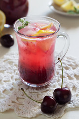 Homemade cherry lemonade with soda in glasses