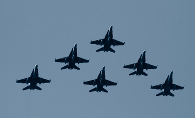 group of figthers plane flying together in formation