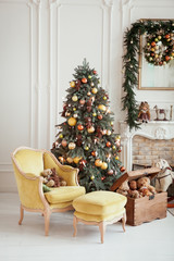 Beautiful Christmas interior. New year decoration. Living room with fireplace