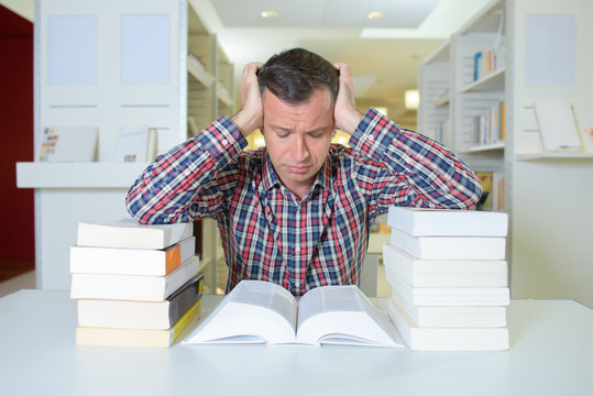 resourceful reader with piles of book