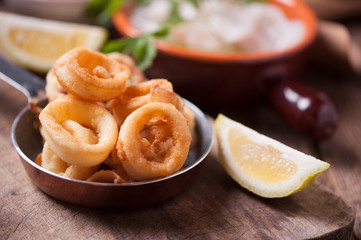 Fried calamari squid on wooden table