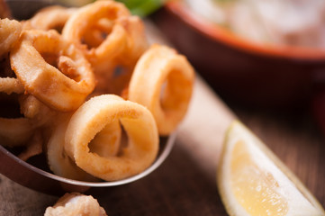 Fried calamari squid on wooden table