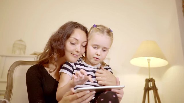 Mother and daugther are spending some time together.