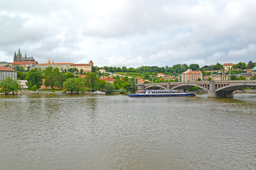 Naklejka premium PRAGUE, CZECH REPUBLIC. A view of the Vltava River and Prague Castle with Saint Vitus's cathedral