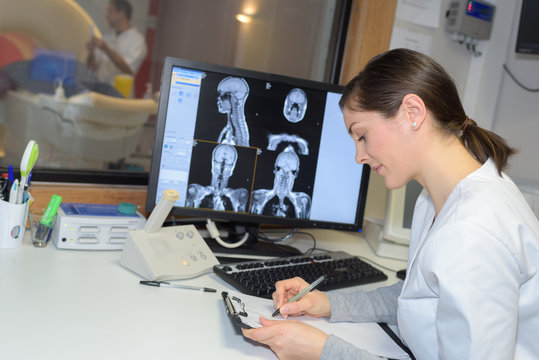 Medical worker analysing scan results