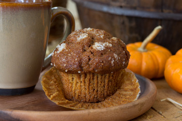 Pumpkin Muffin and Coffee Cup on a Wooden Plate