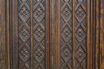 Fototapeta na wymiar Carved old wooden door