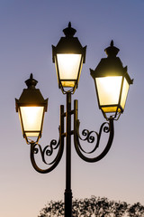 Fototapeta na wymiar glowing stylish lantern in the street