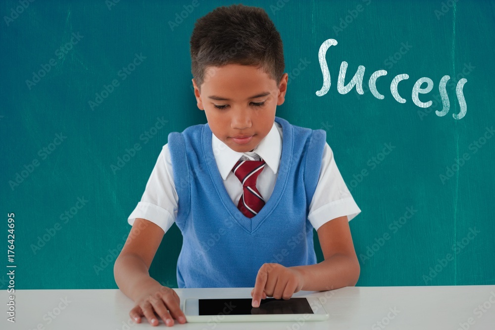 Poster composite image of schoolboy using digital tablet at table