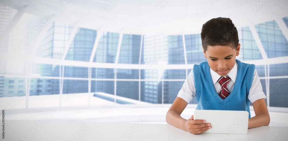 Poster composite image of schoolboy using tablet at table