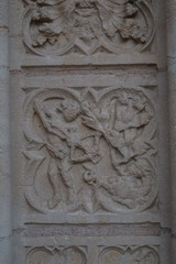 Fototapeta na wymiar Carving of religious scene in stone of a church