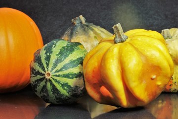 Still life of ornamental gourds in October as a background