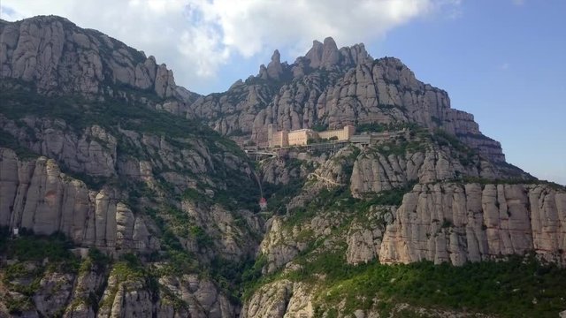 Aerial view of Montserrat mountains and Gaudi-Colonia Guell