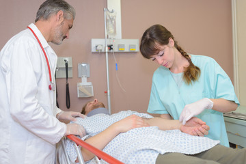 Medical staff examining patient
