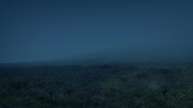 Mist Blowing Over Mountainside At Night