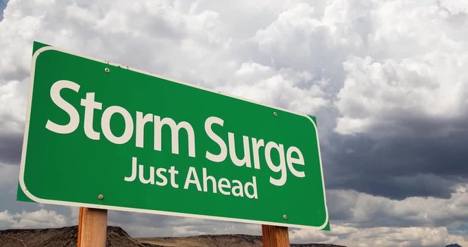 4K Time-lapse Storm Surge Green Road Sign and Stormy Cumulus Clouds and Rain.