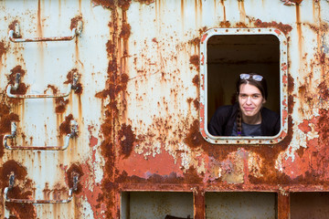 Young stalker woman in an abandoned wagon train.