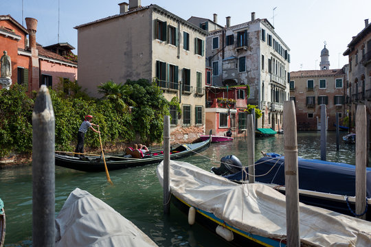 Gondola with tourists in Venice