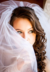 The mysterious bride looks at the window