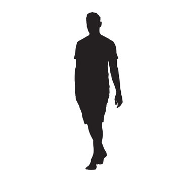 Young man in shirt and shorts walking barefoot, vector silhouette