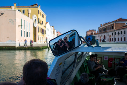 Selfie in mirror on boat in Venice